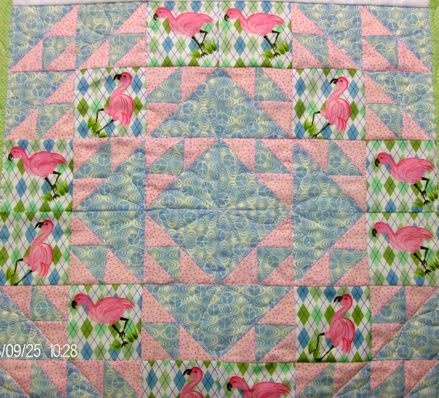 Four quilt blocks sewn together of the Cat's Cradle quilt block.