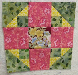 Floral Album Lap Quilt with pockets for wheelchairs or people in nursing homes.