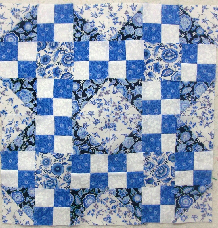 Quilting blog four blocks sewn together of the true blue quilt block.