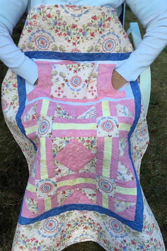 Pretty in Pink Lovie Lap Quilt with Pockets from http://www.HomeSewnByCarolyn.com