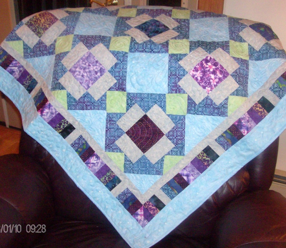 Big T lap quilt made by Homesewn by Carolyn.