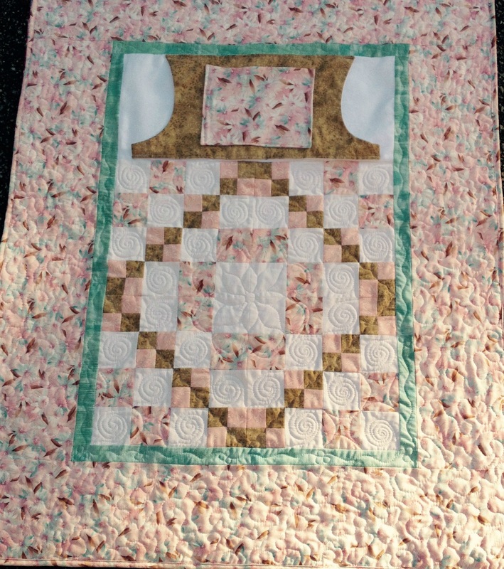 Soft and sweet lap quilt with pockets from http://www.homesewnbycarolyn.com