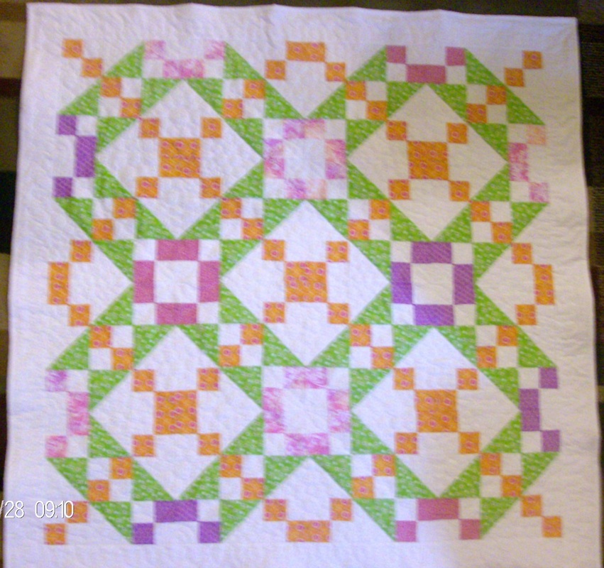 Quilting Blog discussing the Underground Railroad quilt block, turning it into a baby quilt.