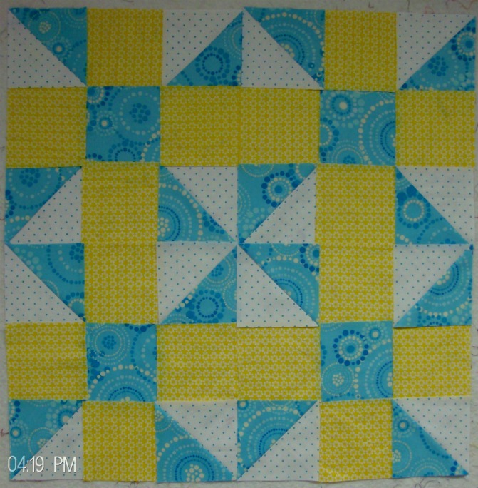 Four blocks together of calico puzzle quilt pattern 