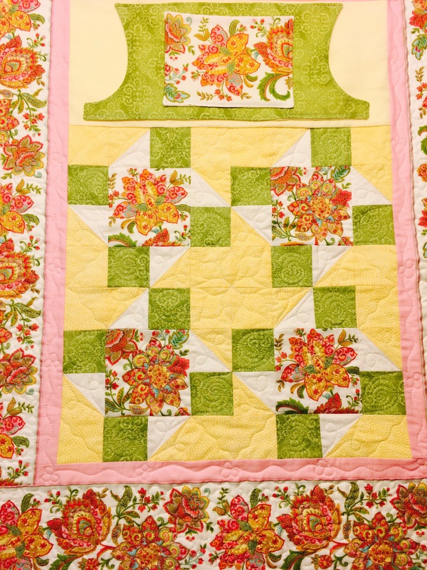 Yellow and Green Lovie Lap Quilt with pockets from http://www.homesewnbycarolyn.com