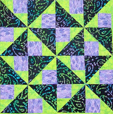 Four blocks of Brave World quilt pattern.