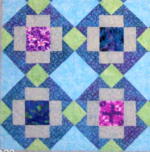 Four Big T quilt blocks sewn together.