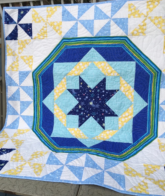 Blue Star Baby Quilt with pinwheels from http://www.homesewnbycarolyn.com