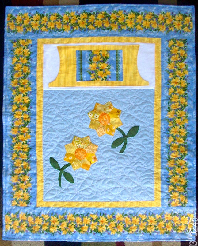 Daisy Lovie Lap Quilt sold and created by Carolyn from Homesewnbycarolyn.com