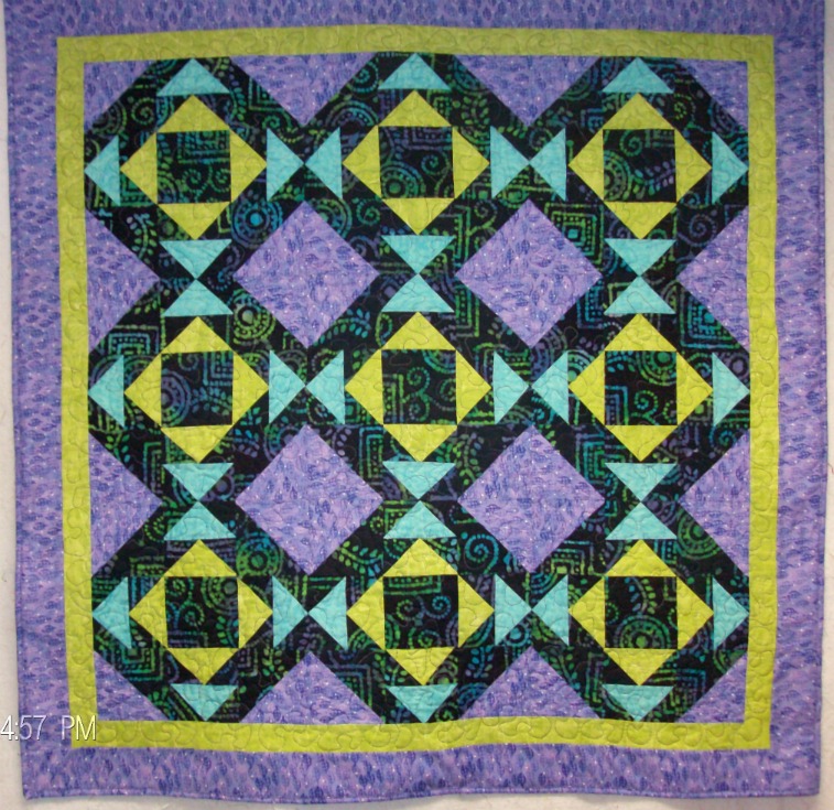 Cups and Saucers Lap Quilt made with batik fabrics.  