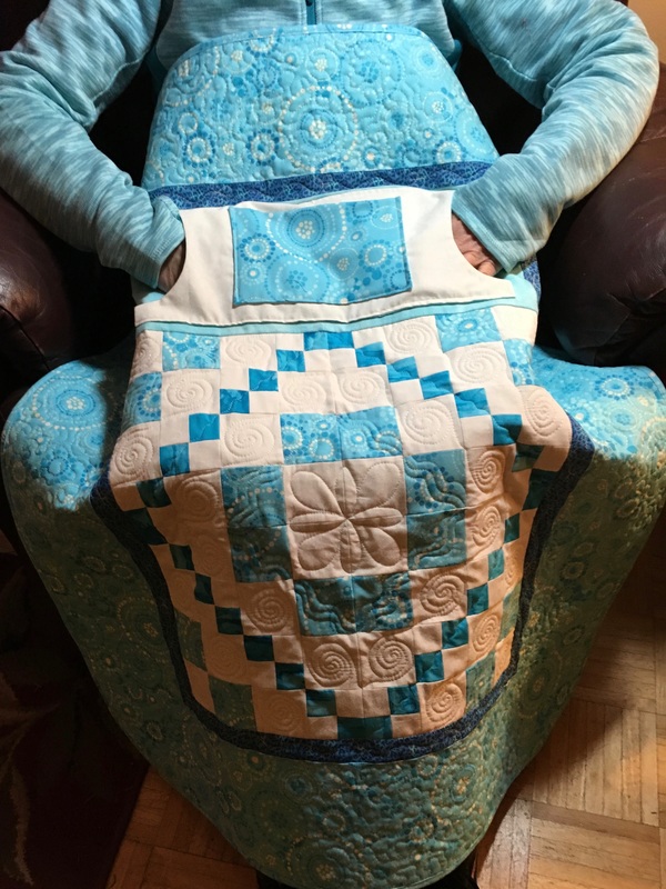 Turquoise Lovie Lap Quilt with Pockets from http://www.homesewnbycarolyn.com