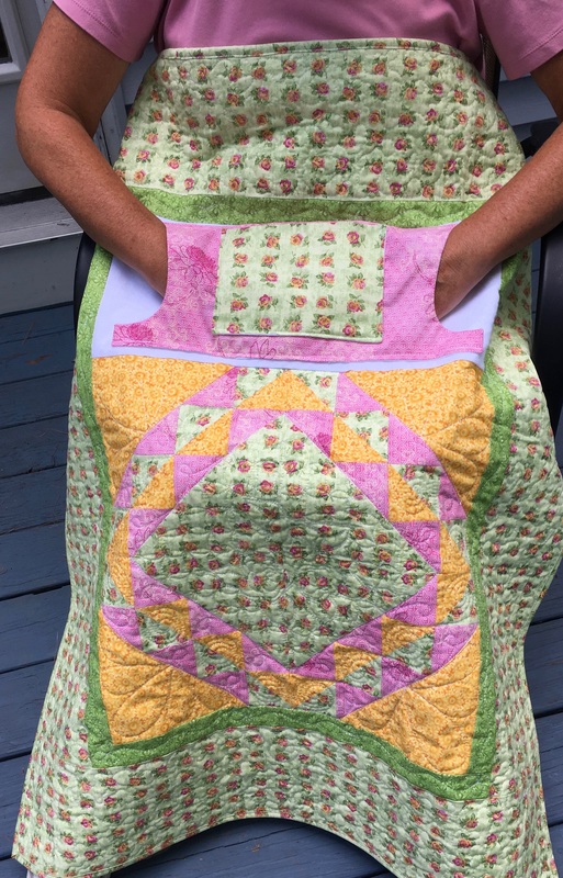 Pink Roses Lovie Lap Quilt with Pockets from http://www.HomeSewnByCarolyn.com