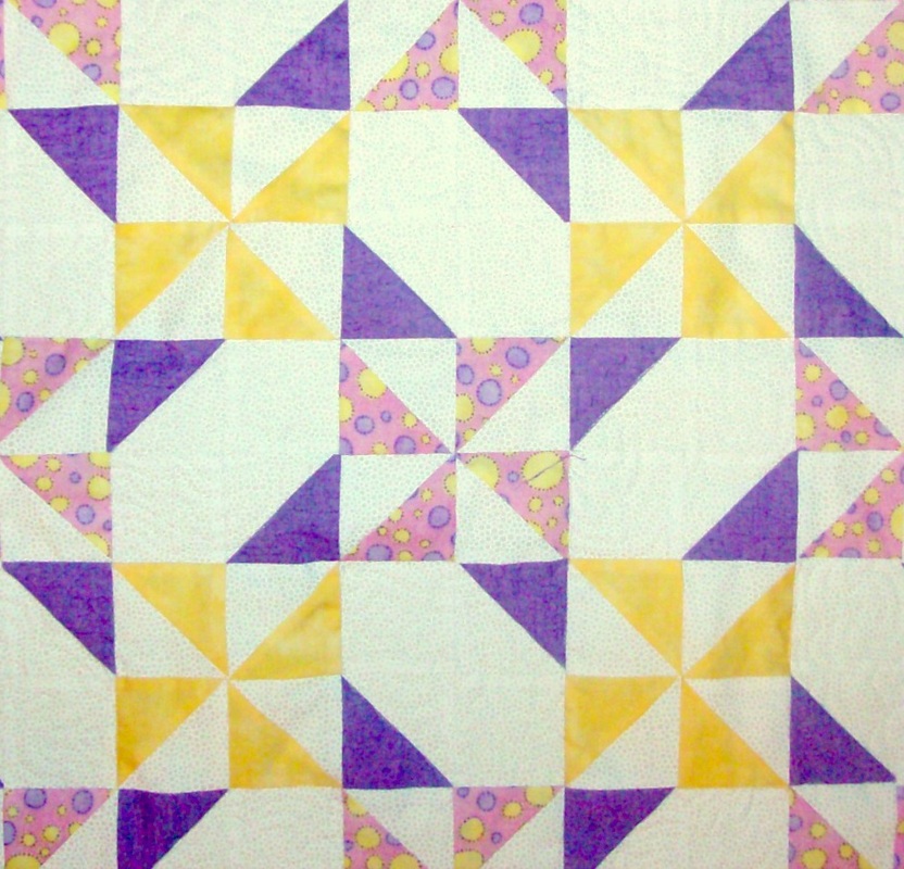Year's Favorite four quilt blocks sewn together by Homesewn by Carolyn.
