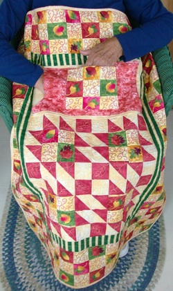 Wheelchair lap quilt with pockets.