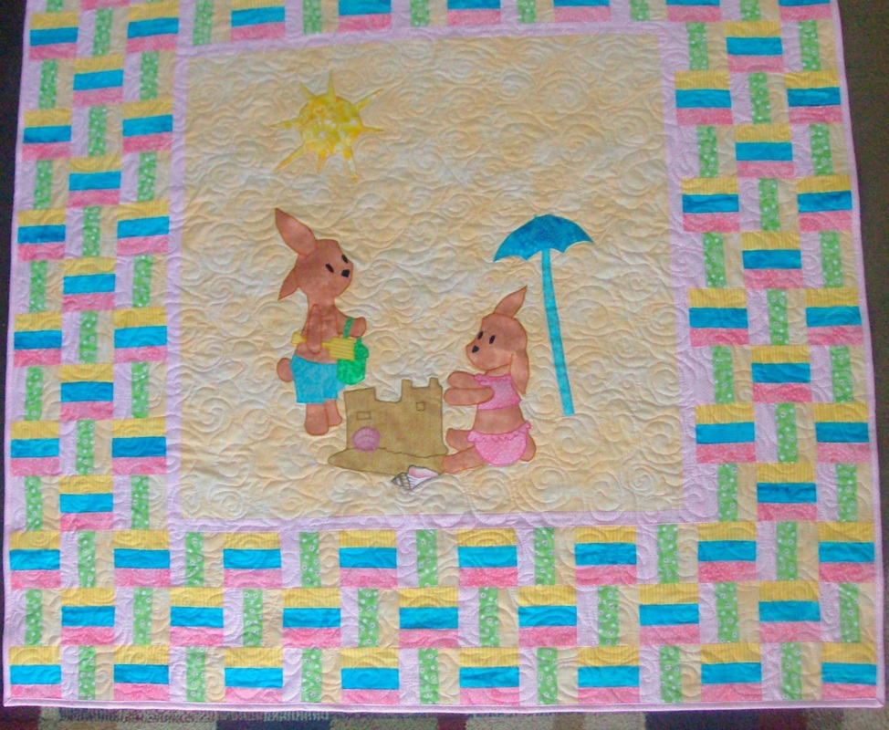 Beach Bunnies Baby Quilt sold by Homesewn by Carolyn, original desin by artist, Wendy Mierop.