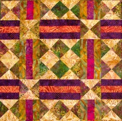 Four squares of Chain and Hourglass Quilt Block.