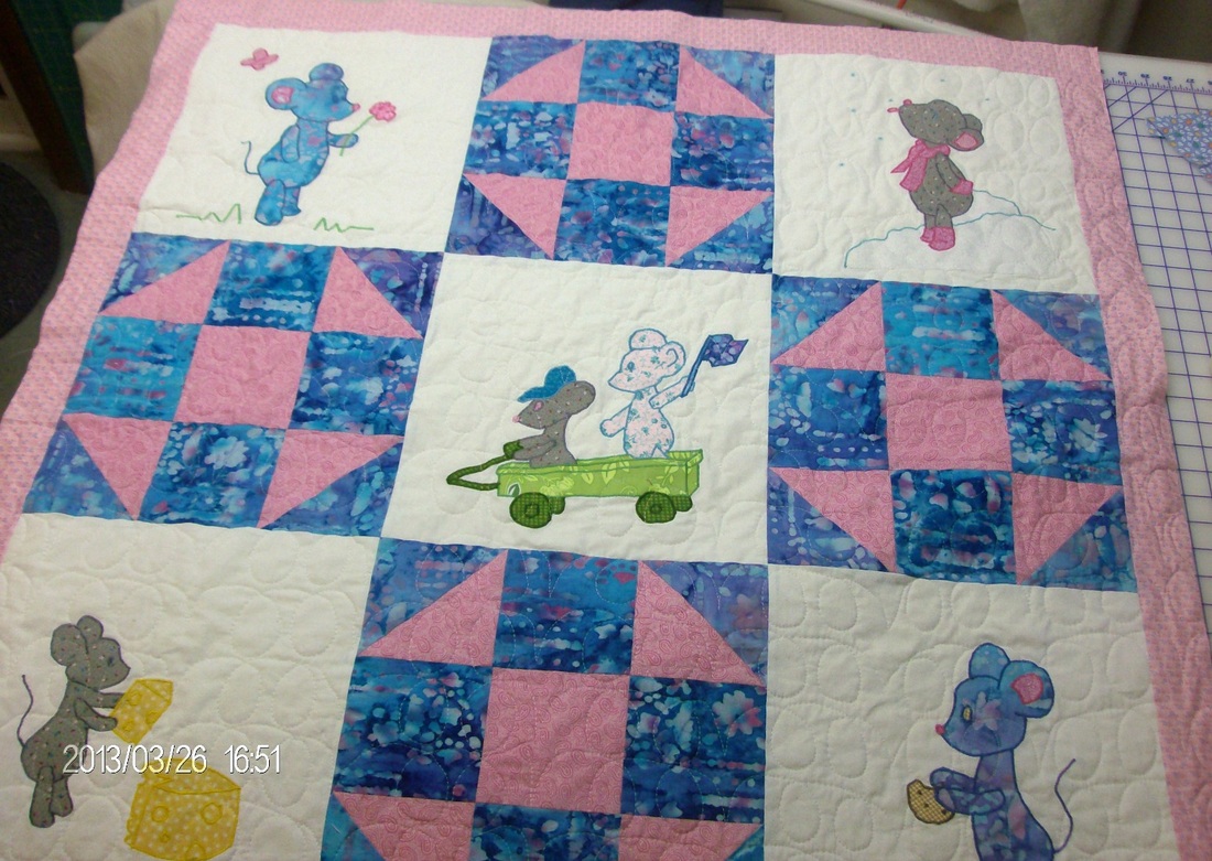 Milo the Mouse Baby Quilt sewn by Homesewn by Carolyn and discussed in my quiting blog.