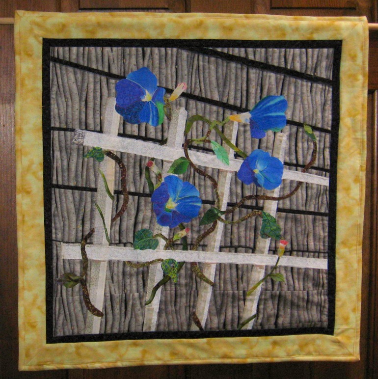 Beautiful Morning Glory wall hanging created by Carolyn taken from a photo off the coast of Maine.