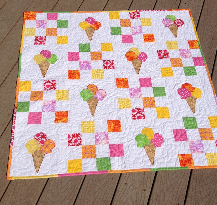 Colorful ice cream cone quilt from http://www.homesewnbycarolyn.com/baby-quilts.html