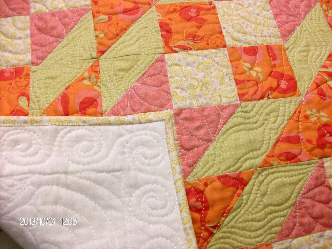 Beautiful baby quilt made with the Double X No. 3 quilt block.