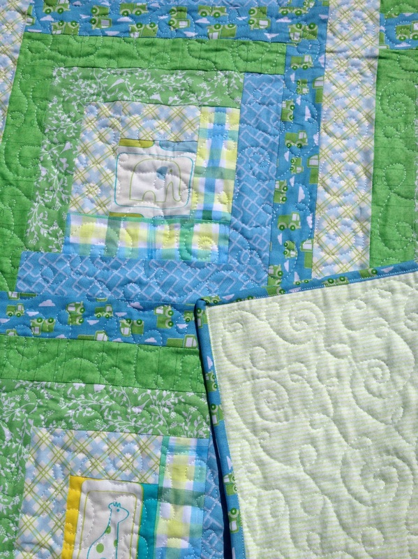Blue and green log cabin baby quilt from http://www.homesewnbycarolyn.com