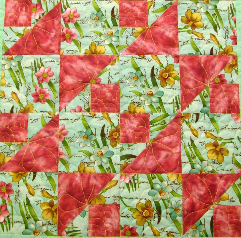 Four blocks of Spool and Bobbin quilt block from 