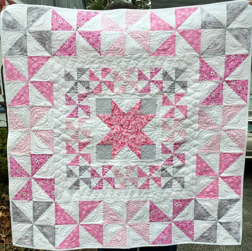 Pink, Grey and White Pinwheel Baby Quilt from http://www.HomeSewnByCarolyn.com