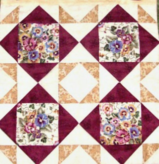 Four blocks sewn together of the Cypress quillt block.