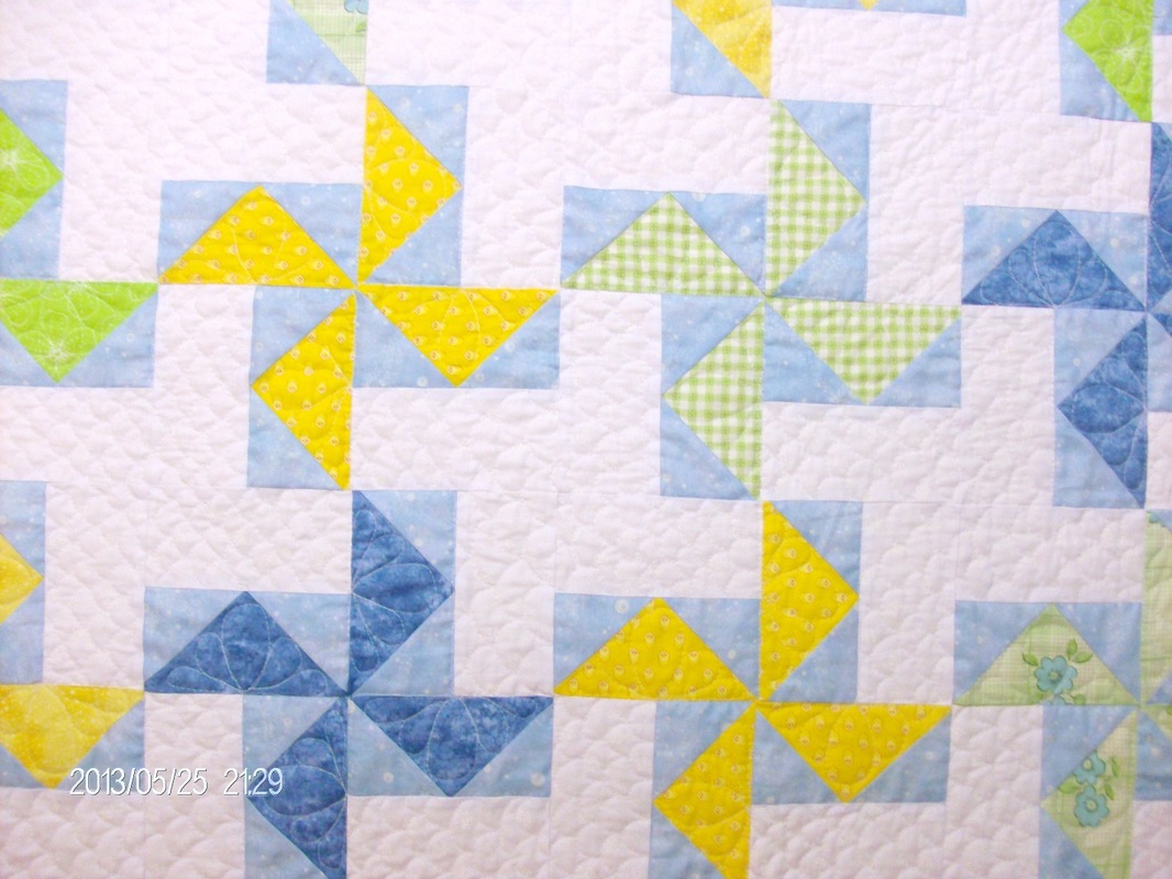 Beautiful pinwheel baby quilt from Homesewn by Carolyn.