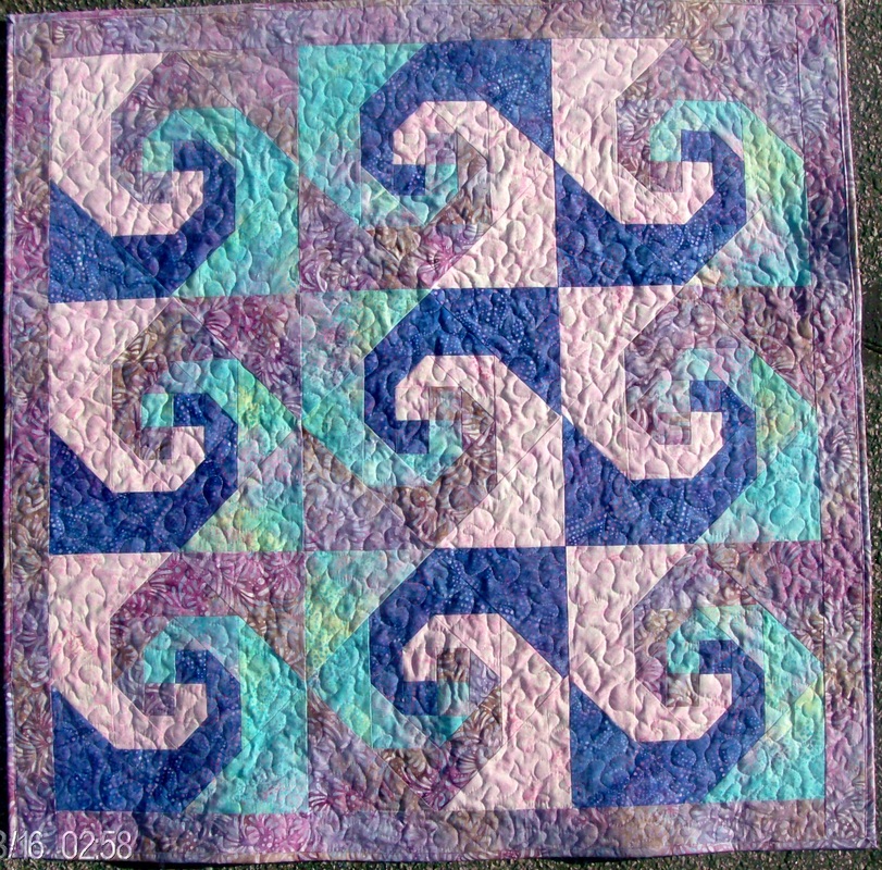 Quilting Blog from Homesewn by Carolyn.  This is the design I chose for the Snail'sTrail quilt block.
