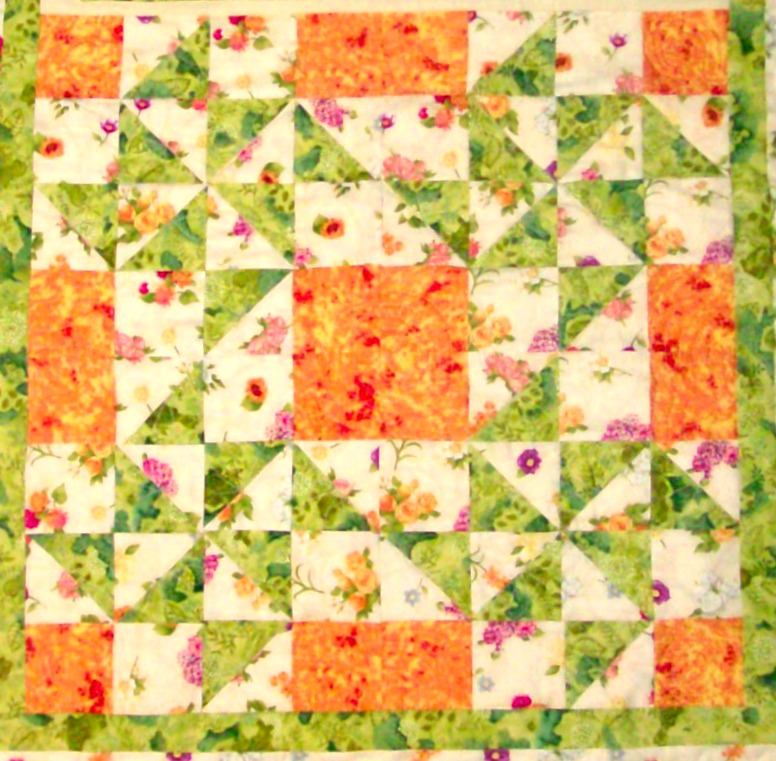 Fou quilt blocks sewn together of X Quartet quilt block.