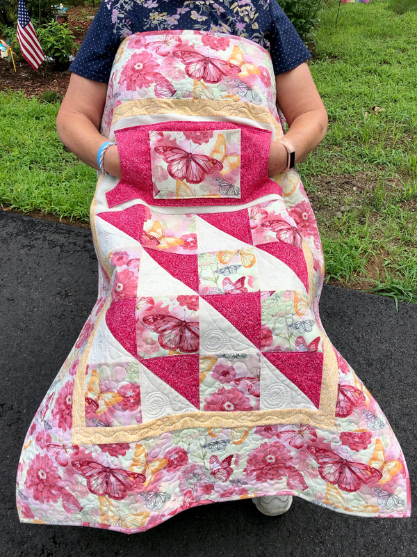 Blooming Butterfly Lovie Lap Quilt with Pockets for sale.