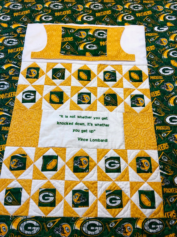 Green Bay Packers Lovie Lap Quilt with Pockets from http://www.HomeSewnByCarolyn.com/lovie-lap-quilts.html