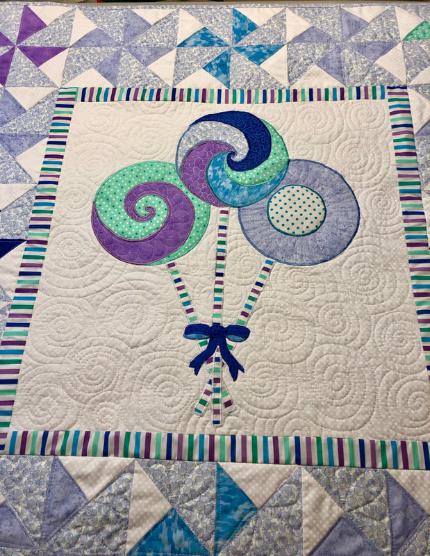 Lollipop Baby Quilt for sale from http://www.HomeSewnByCarolyn.com 