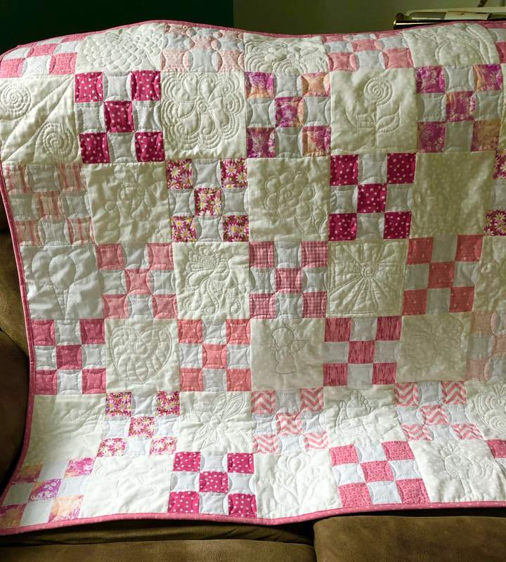 Pink and White Nine Patch Baby Quilt from http://www.HomeSewnByCarolyn.com/baby-quilts.html 