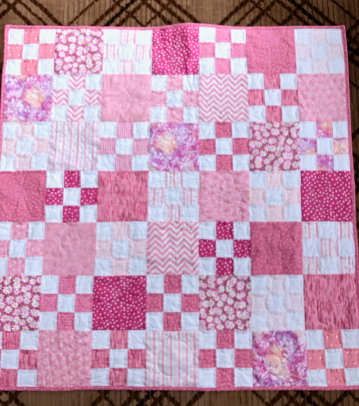 Pink and White Nine Patch Baby Quilt, baby shower gift from http://www.HomeSewnByCarolyn.com/baby-quilts.html 