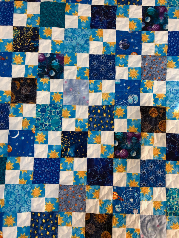 Stars and Sun Handmade Baby Quilt for sale from http://www.HomeSewnByCarolyn.com 