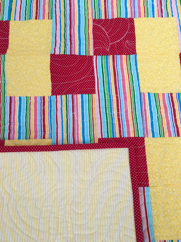 Red and Yellow Baby Quilt with flannel backing for sale from http://www.HomeSewnByCarolyn.com