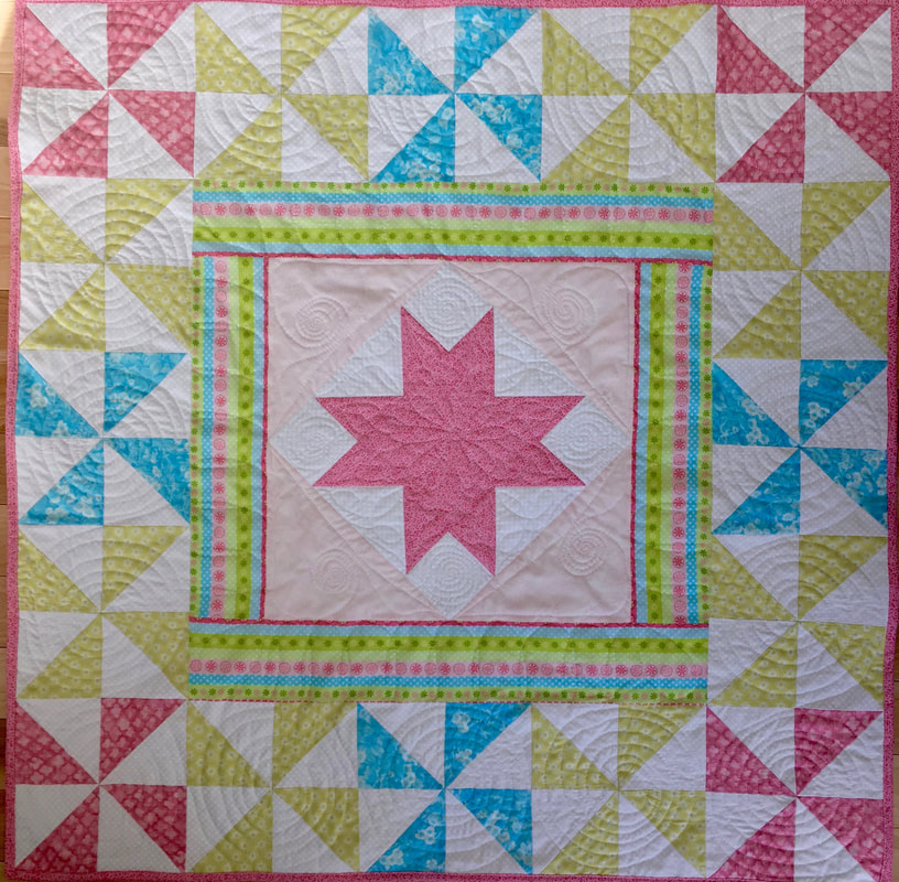 Pink Star Baby Quilt from http://www.HomeSewnByCarolyn.com