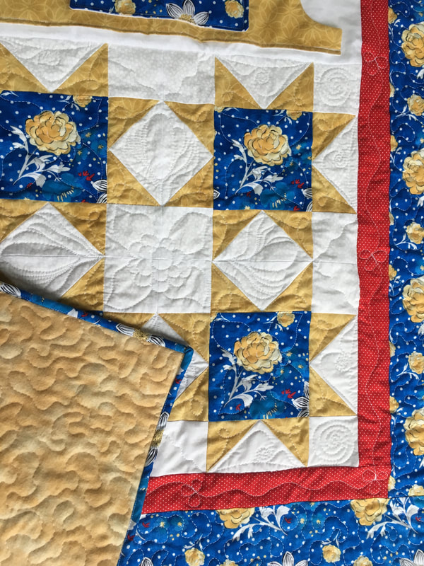 Lovie Lap Quilt with Pockets and flannel backing from http://www.HomeSewnByCarolyn.com