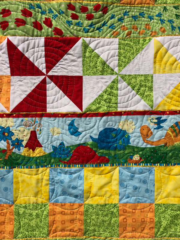 Dinosaur Baby Quilt from http://www.HomeSewnByCarolyn.com/baby-quilts.html