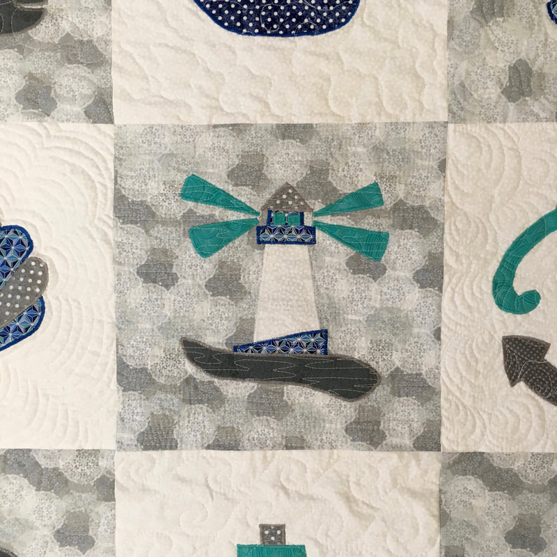 Lighthouse on baby quilt from http://www.HomeSewnByCarolyn.com