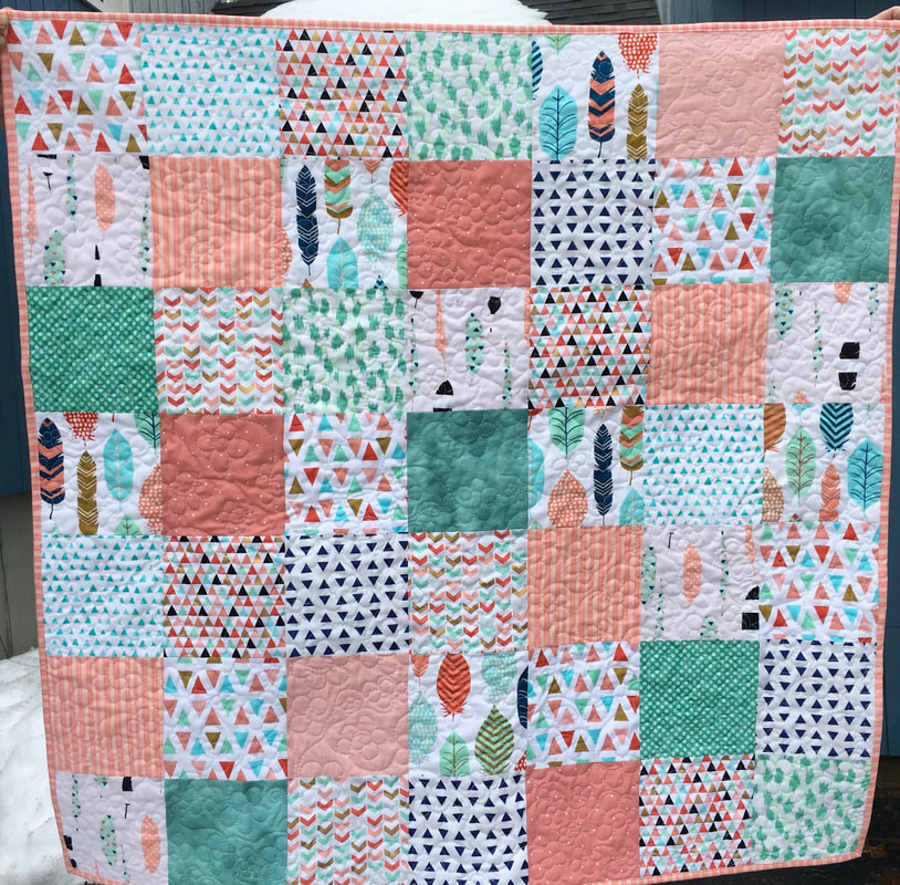 Peach and Green Tribal Baby Quilt from http://www.HomeSewnByCarolyn.com 
