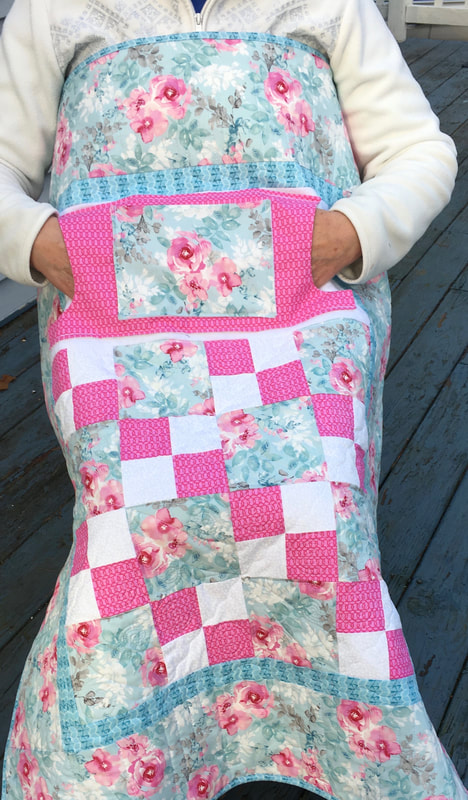 Pink Roses Lovie Lap Quilt with Pockets from http://www.HomeSewnByCarolyn.com