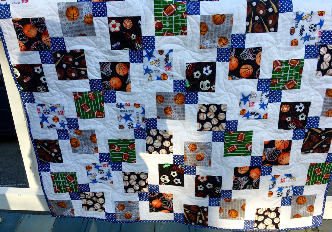 Sports Baby Quilt from http://www.HomeSewnByCarolyn.com