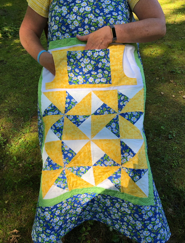 White Daisy Lovie Lap Quilt with Pockets from http://www.HomeSewnByCarolyn.com 