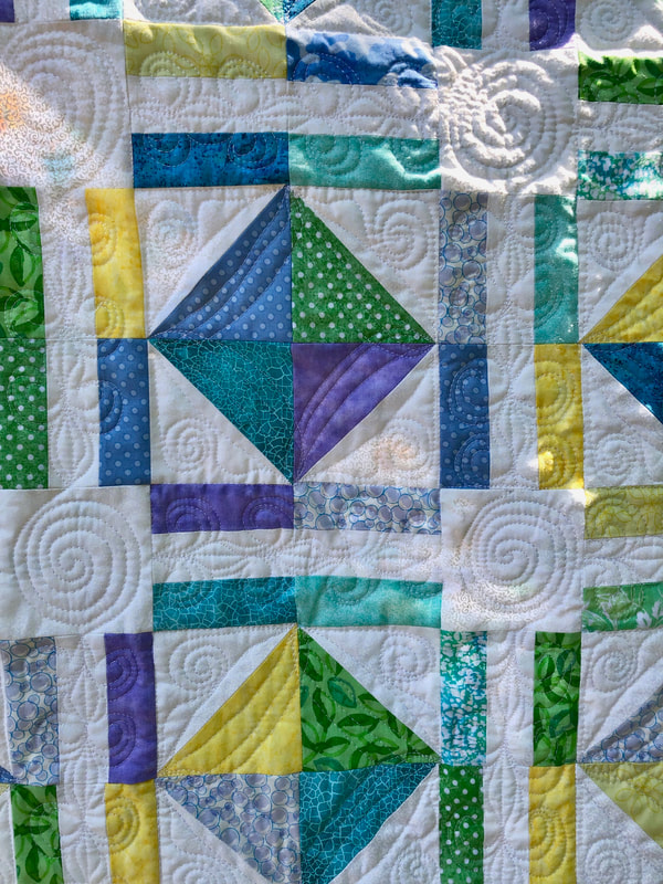 Free motion quilting on friendship baby quilt from http://www.HomeSewnByCarolyn.com/baby-quilts.html 