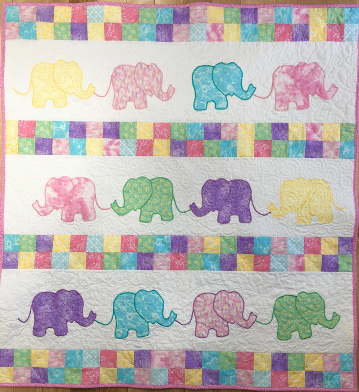 Pastel Elephant Baby Quilt for sale from http://www.HomeSEwnByCarolyn.com