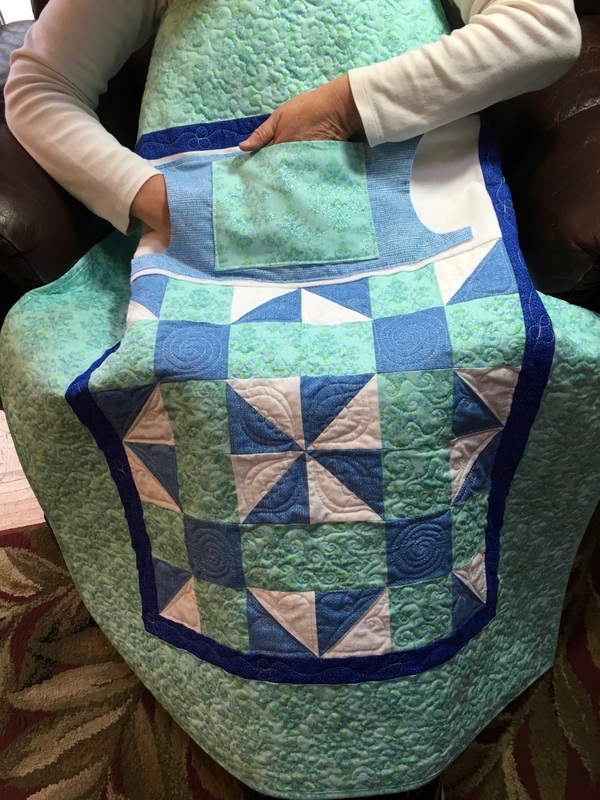 Teal and Blue Lovie Lap Quilt with Pockets from http://www.HomeSewnByCarolyn.com