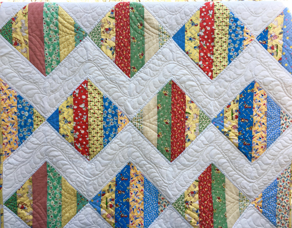 1930's Reproduction Scrappy Baby Quilt for sale from http://www.HomeSewnByCarolyn.com